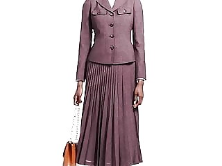 LADY WEARING NICE PLEATED SKIRT SUIT